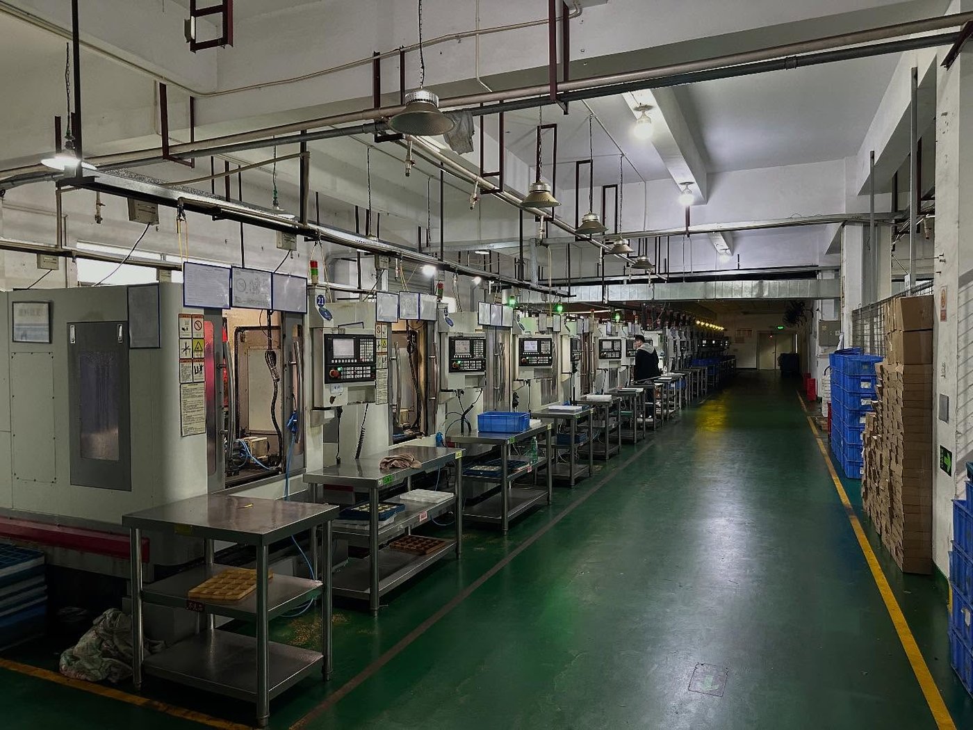 Row of CNC machining centers on the Orranni production floor